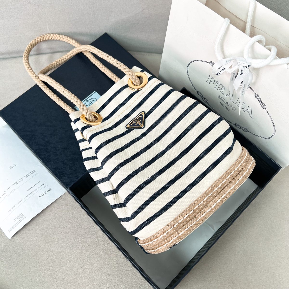 Prada Mariner small striped fabric bucket bag - Image 1